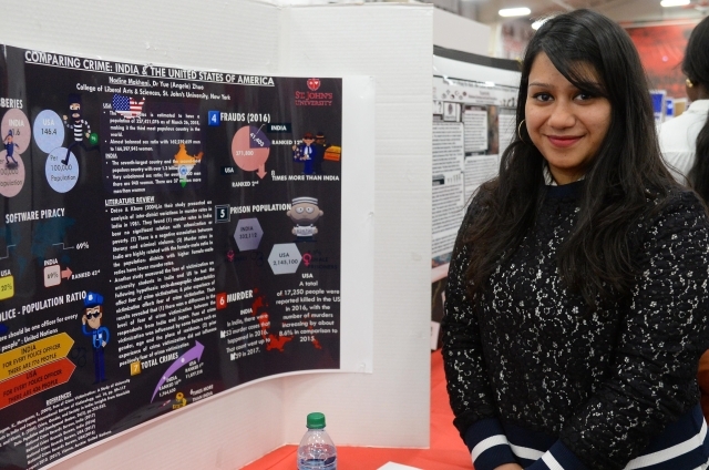 female student infront of her presentation