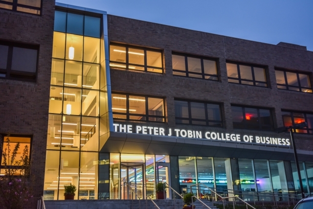 Peter J. Tobin College of Business Building Exterior at Night