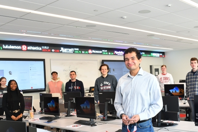 Student-Managed Investment Funds students posing 6 feet apart in computer lab