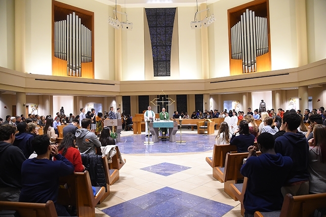 Wide shot of Mass at St. Thomas More Church