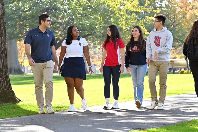 Students walking together outdoors on campus