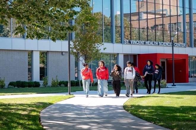 Students walking outside St. Vincent Health Sciences Center