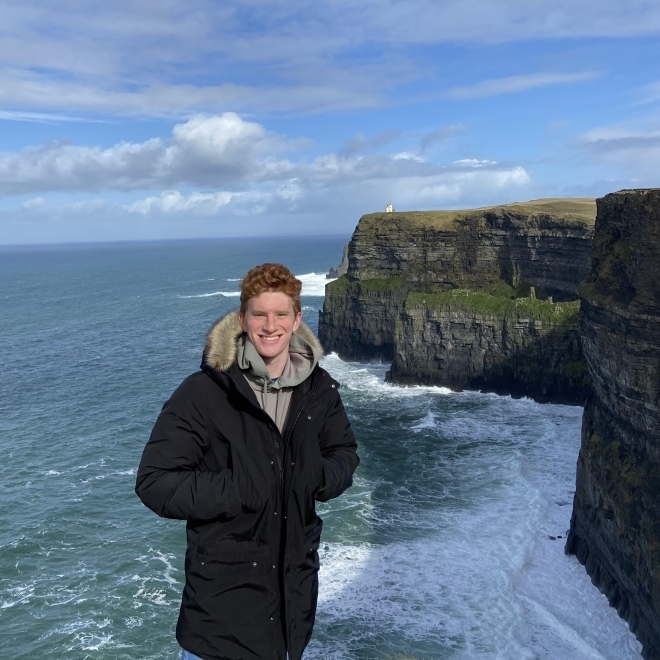 Jeffrey Schrader standing on cliff