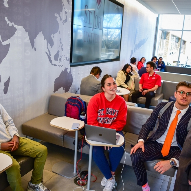 Faculty member talking to students