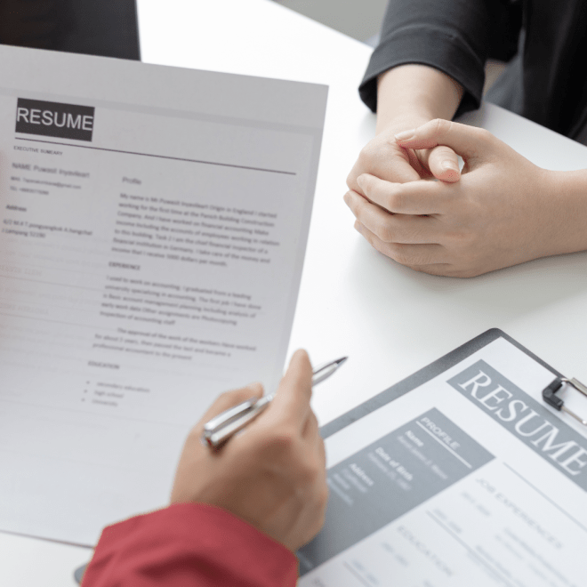 Recruiter looking at an interns resumes 