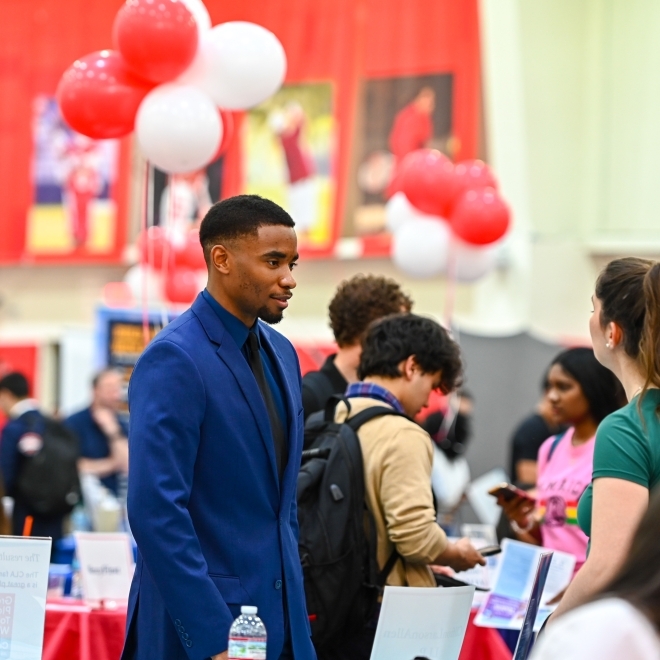 Student exploring his career interests at a job fair 