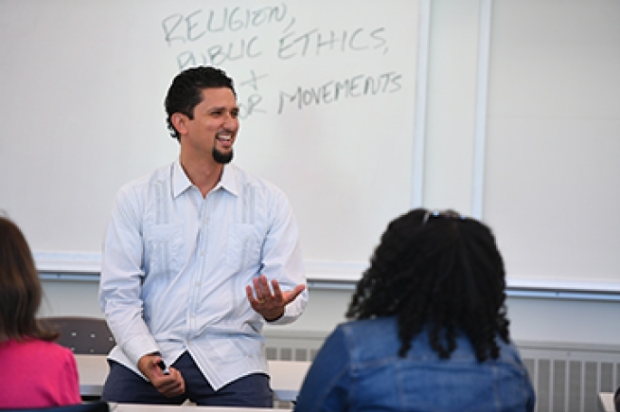 Male Faculty Member in front of white board