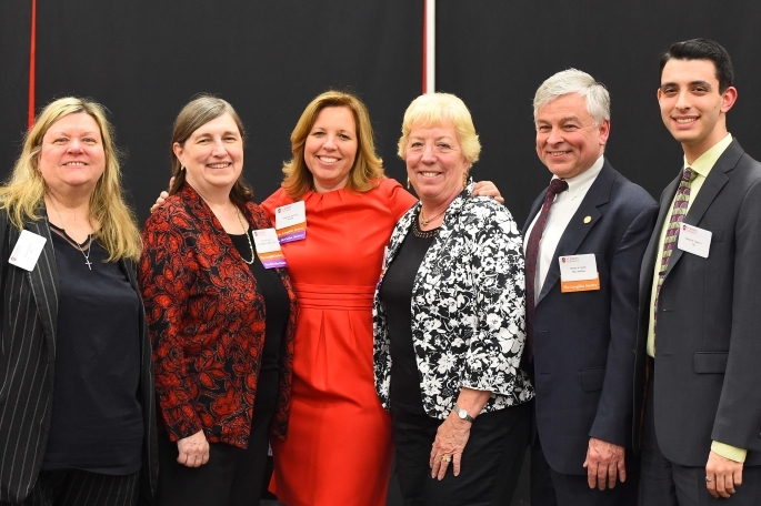 6 Alumnus posing for a photo