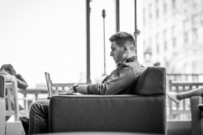 Graduate Student with laptop black and white