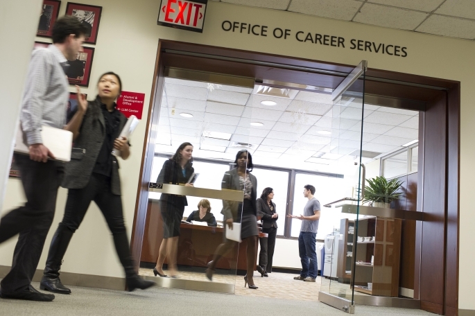 Students walking past Career Development office