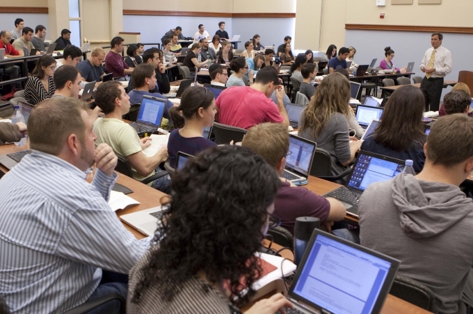 Students in lecture hall listening to professor