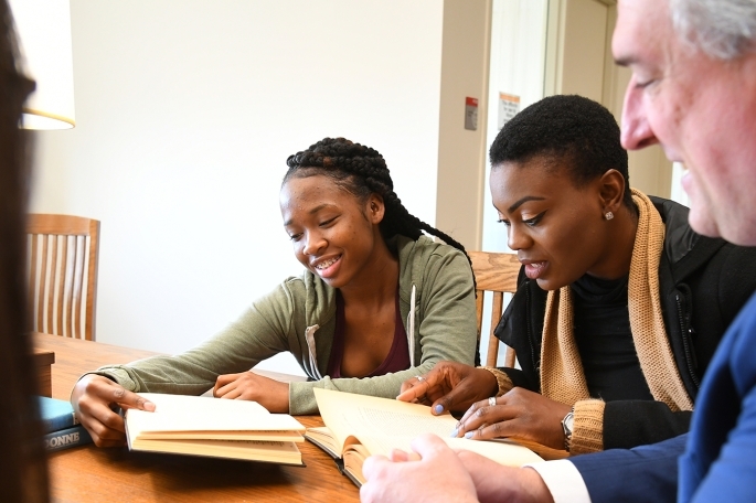 Faculty and students at library