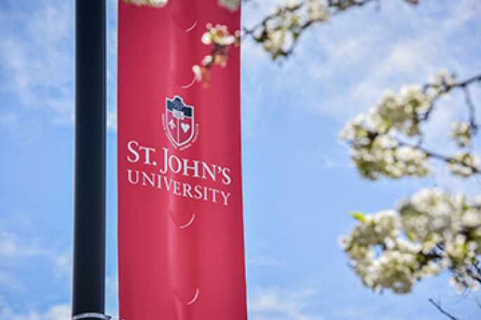 Street banner with St. John's University logo