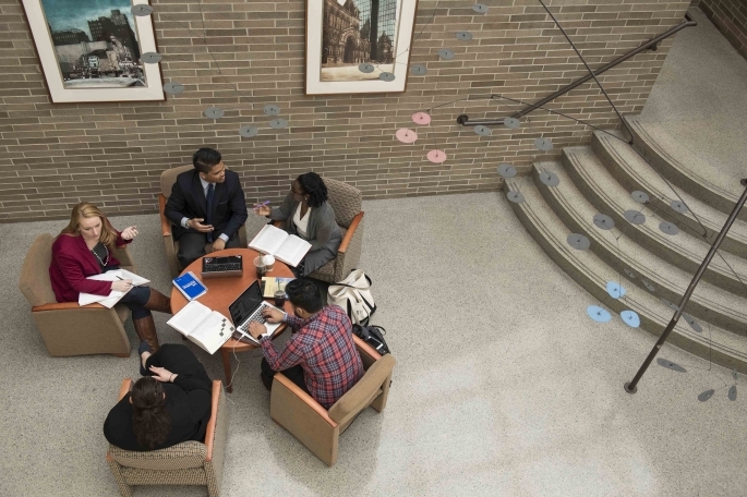 Overhead shot of students studying in lobby