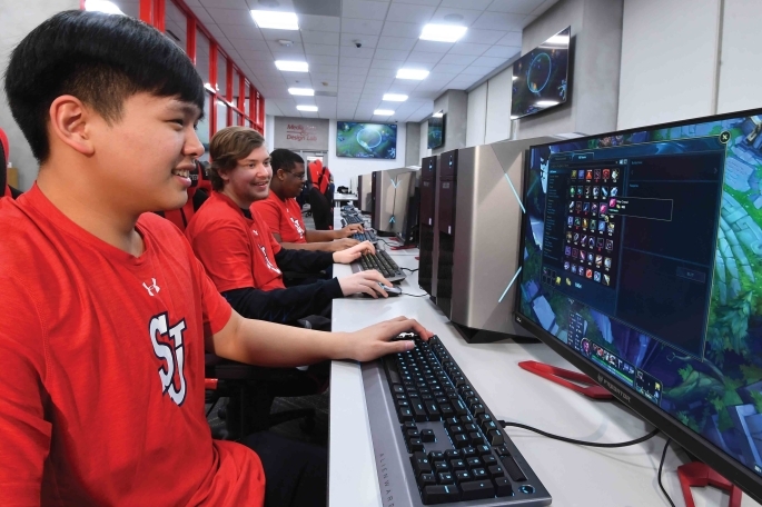 Student playing esports on computers