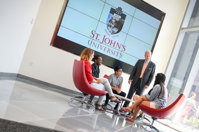 Tobin professor with seated students