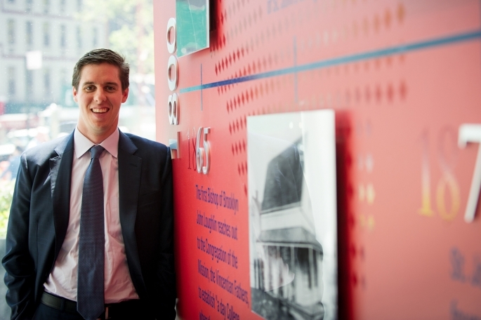 Male standing up against timeline wall