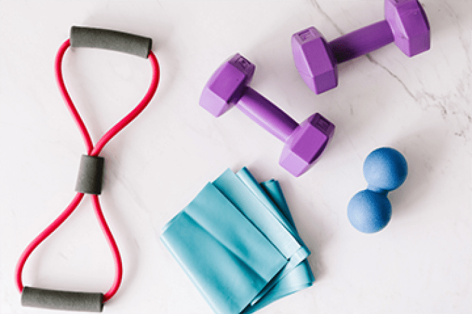 Stock photo of hand weights, squeeze balls and resistance bands