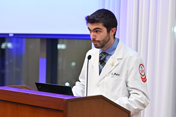 Student speaking at podium at Radiologic White Coat Ceremony