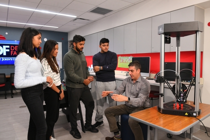 Students talking to a professor in the Design factory