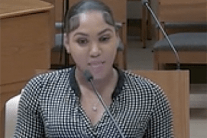 Madison King speaking into microphone