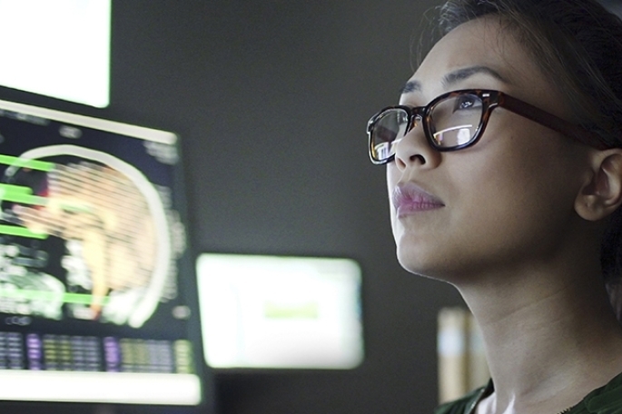 Neuroscience student looking at computer monitor
