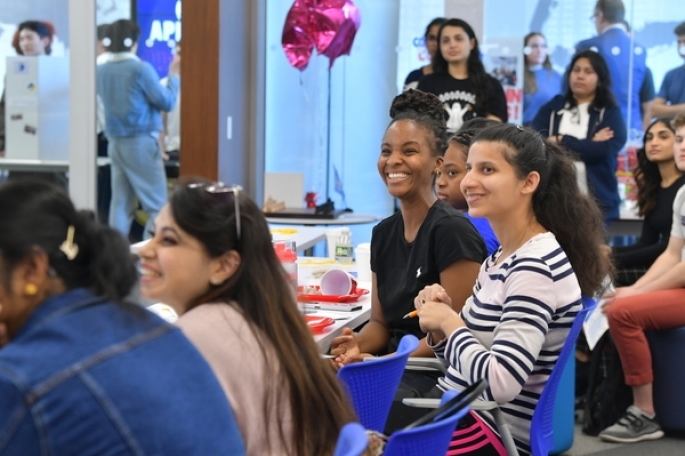 Students smiling during presentation at the SJU Venture Innovation Center