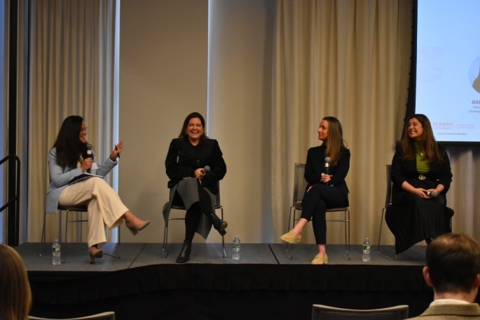 Panel speaking on a stage