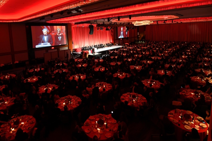 Dinner in Ballroom with speakers on screen at podium