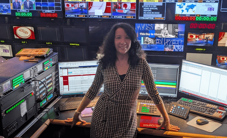 Women in front of computer monitors room