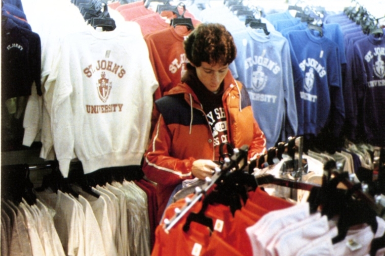 A student browses the many colorful St. John's University sweatshirts at the campus bookstore in 1982.