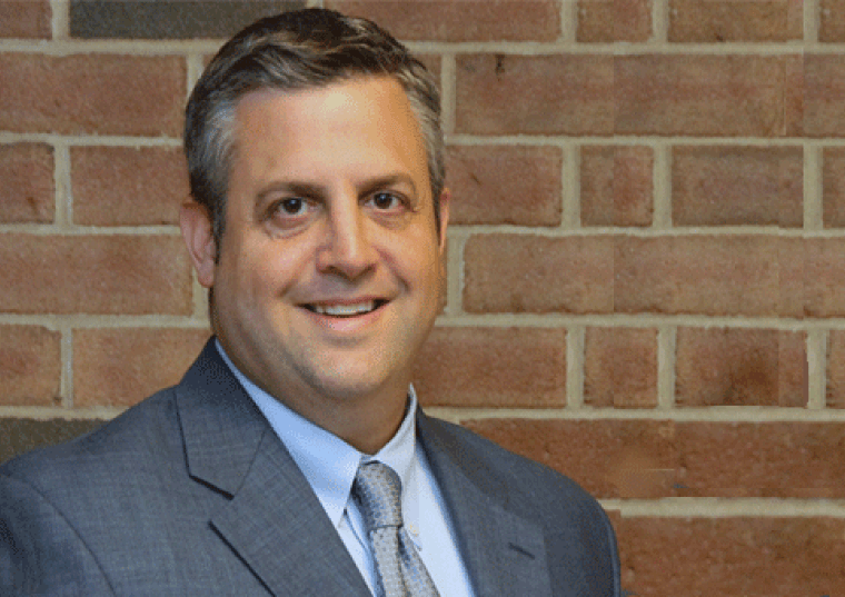 Donald Murphy headshot against brick wall