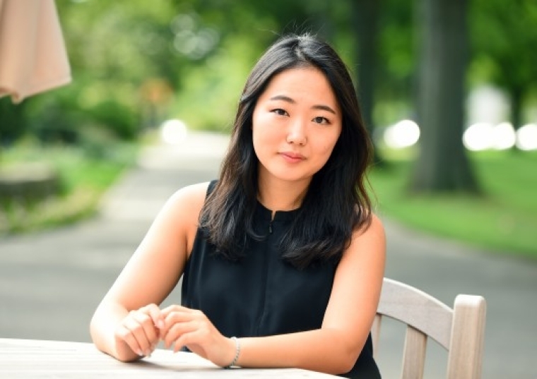 Kisong Kim, Ed.M. headshot, sitting outside