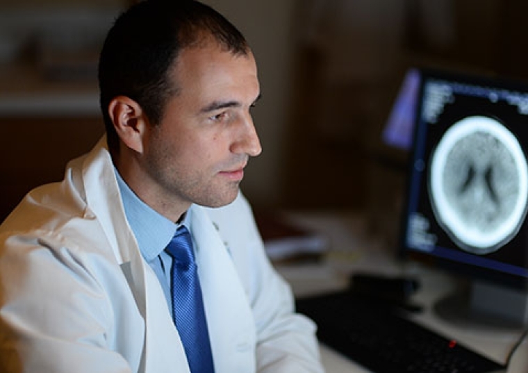 Andriy Vintonyak ‘12P sitting in lab