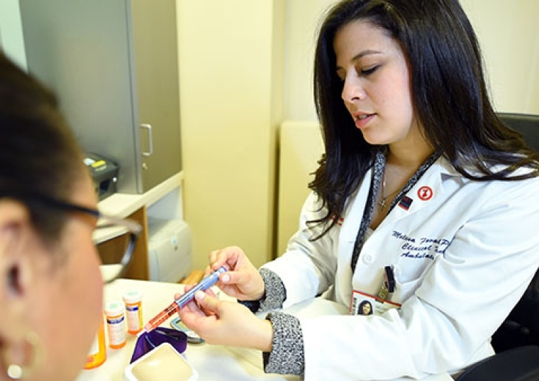 Melissa Favale-O'Brien handling pharmacy materials
