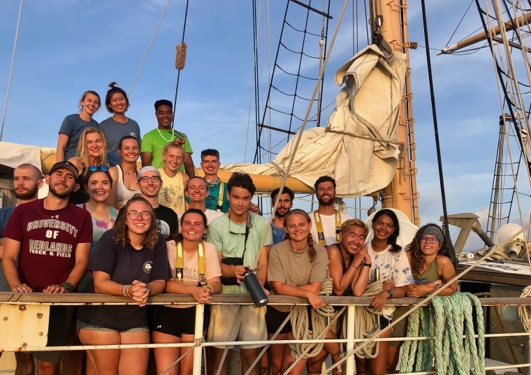 Group of people including Connor Cummings on a boat out to sea