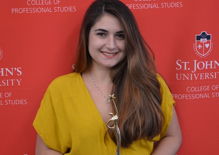 Abigail Dell’Orto holding award