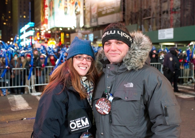 Nancy Silvestri standing with man in Time Square on New Years Eve