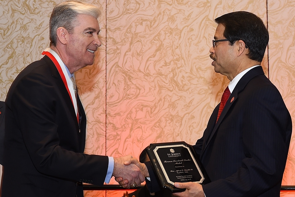 Alfred Cerullo and President Gempesaw shaking hands