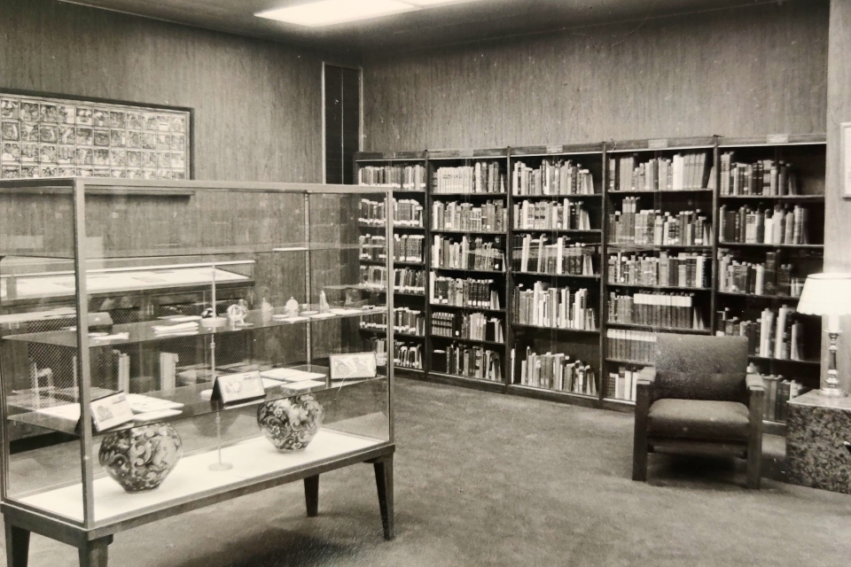 The original Special Collections reading room with artifacts, artwork, and rare books on display.
