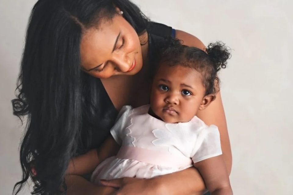 Young woman holding her child 