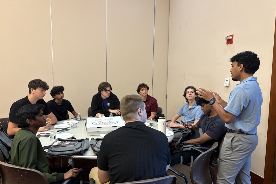 Student speaking in front of a group of students