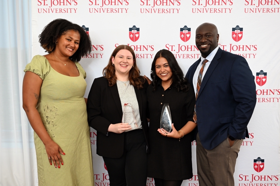 Student holding an award
