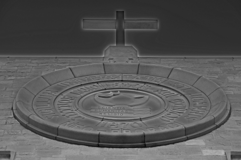 Stone crucifix with engraved circle underneath
