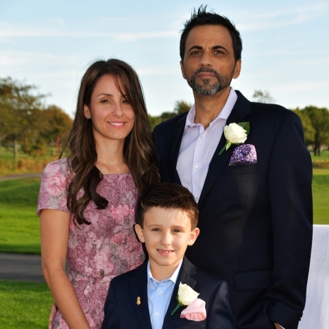 The Randazzese Family posting for a group shot outside
