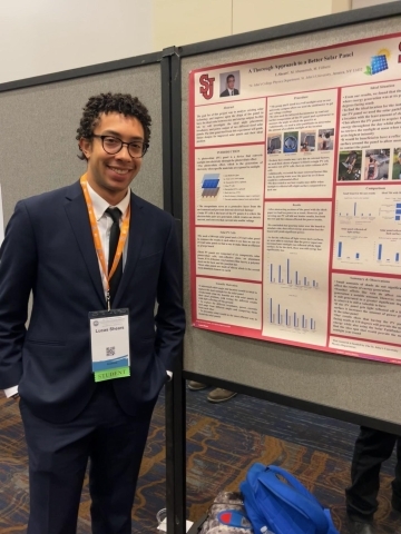 Lucas Shears posing next to poster at 2023 National Society of Black Physicists Conference 