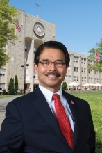 President Gempesaw standing infront of St. Augustine Hall