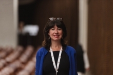 Woman standing looking at camera