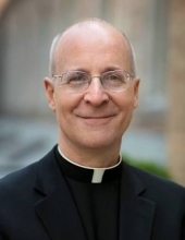 Catholic Priest looking at camera