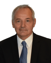 Man in suit facing camera